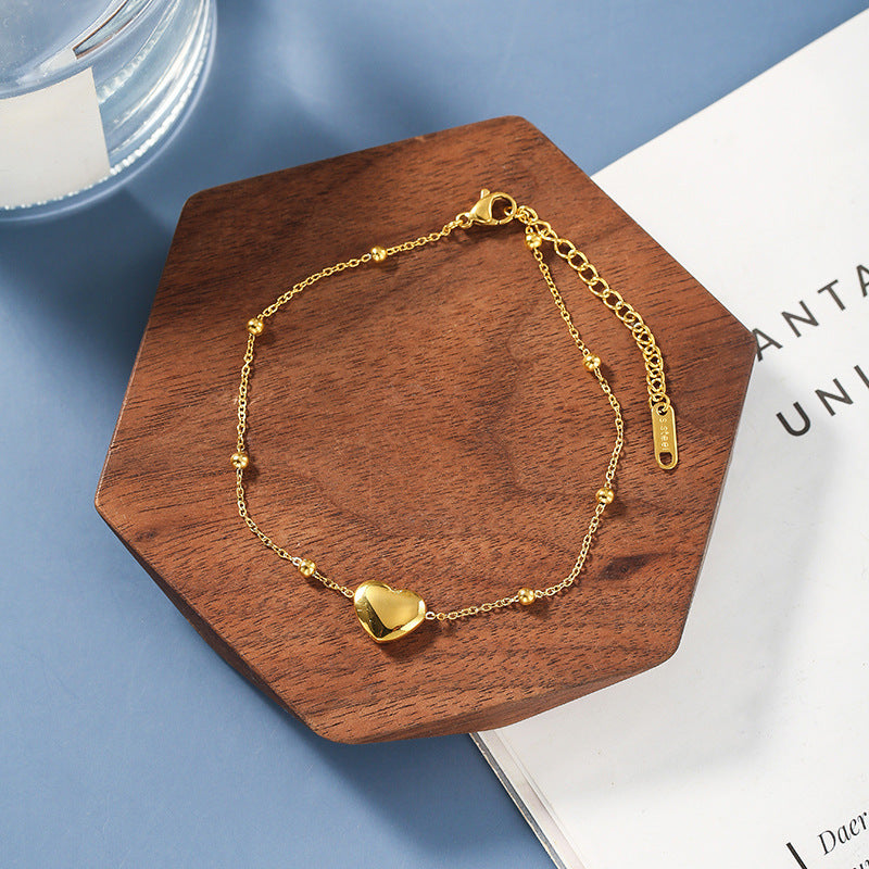 Gold Heart-Shaped Pendant Bracelet in Titanium Steel