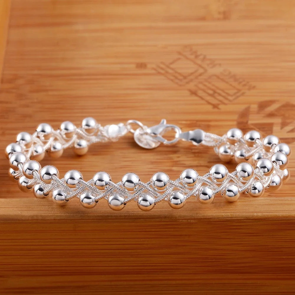 Strovlin 925 Sterling Silver braided beaded chain bracelet for women, featuring intricate craftsmanship and polished silver finish.