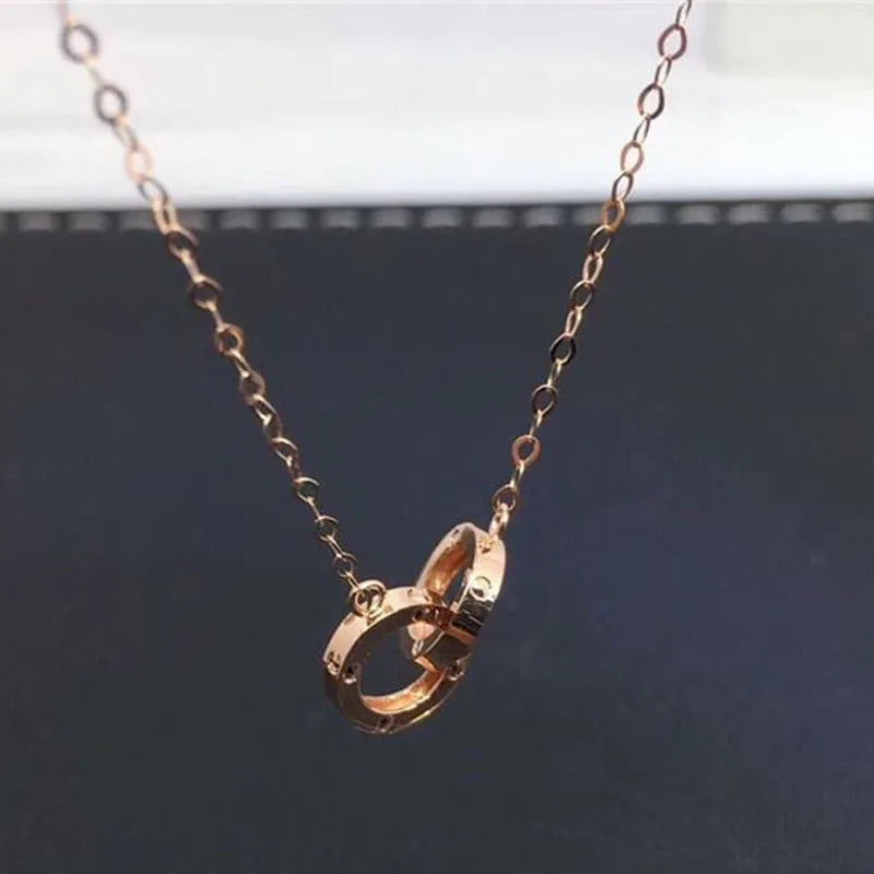 Strovlin 14K Rose Gold double ring pendant necklace for women, featuring a delicate chain and elegant double ring design.