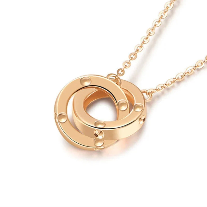 Strovlin 14K rose gold double ring pendant necklace for women, featuring a delicate chain and elegant ring design.