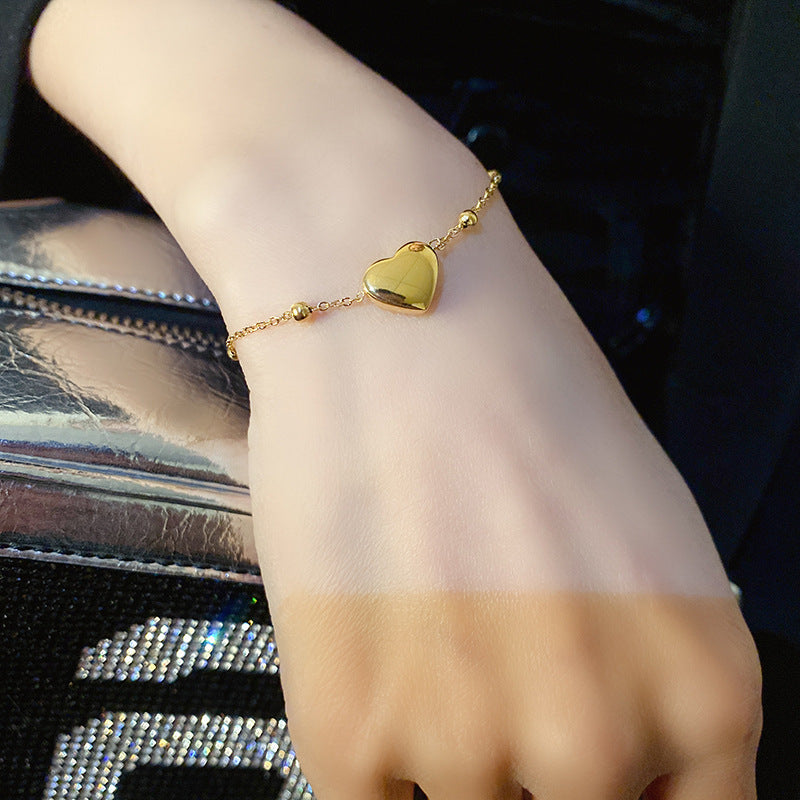 Gold Heart-Shaped Pendant Bracelet in Titanium Steel