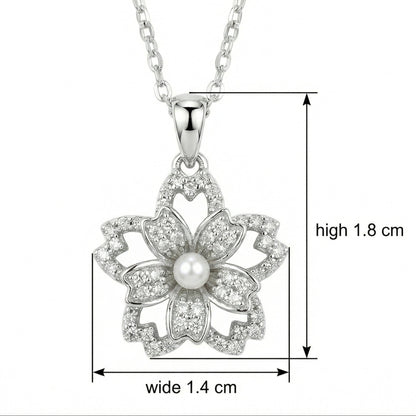 Silver necklace with a floral pendant and pearl, shown with measurements on a white background.